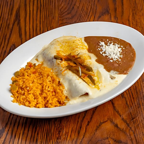 Mariano's enchiladas with white sauce, rice, and refried beans on a white plate.
